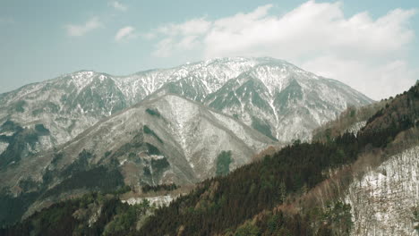 stunning view of snowcapped hills on winter at okuhida hirayu, gifu japan