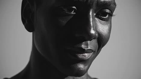 montage showcasing a range of subtle facial expressions on a person of color, highlighting nuances of emotion and the interplay of light and shadow on skin