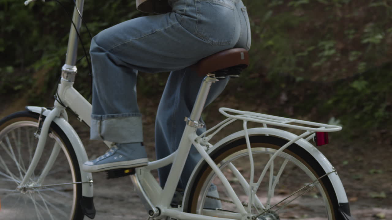 A person rides a bicycle outdoors