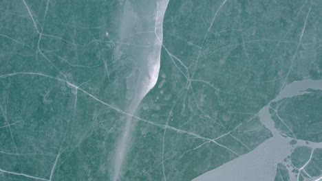 ice patterns on a frozen lake surface