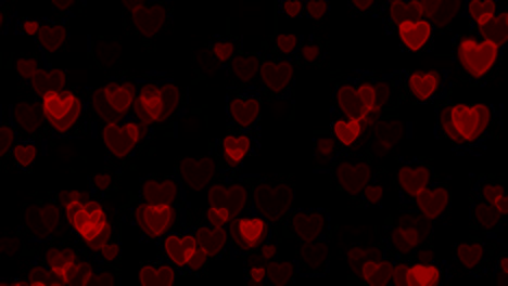 corazones rojos sobre fondo negro