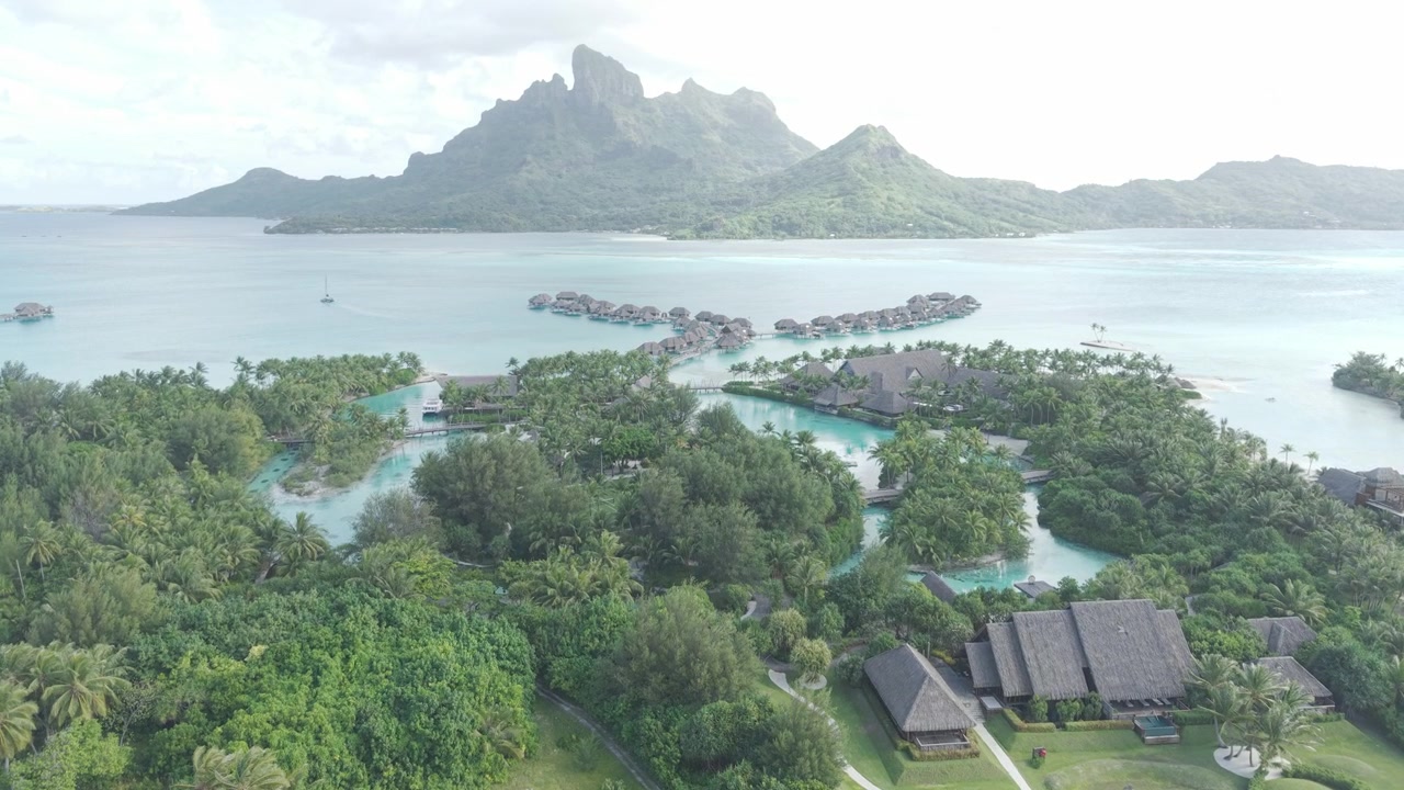 Drone Shot of Bora Bora Island and Luxury Resort WIth Lagoons and Overwater Bungalows, French Polynesia