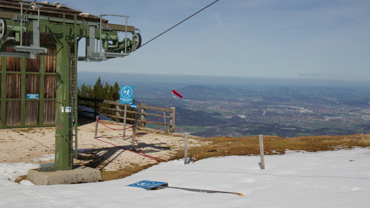 Ski Lift Station With Snowy Terrain And Windsock. Bavarian Alps In Berchtesgaden, Germany. wide shot