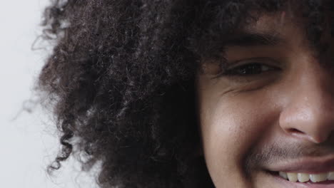 close-up-mixed-race-man-eye-looking-at-camera-happy-smiling-satisfaction-success