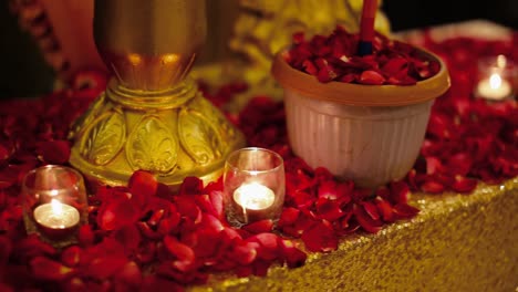 Candles-in-the-glasses-and-rose-petals-on-the-table