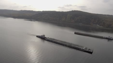 4k video flight. dawn on the great european river dnepr. meeting of two cargo ships.