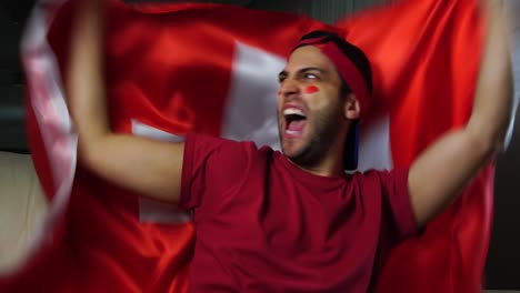 switzerland guy celebrating with swiss flag