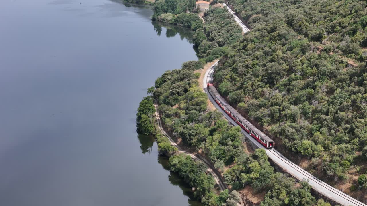 Historical train riding next do Douro river