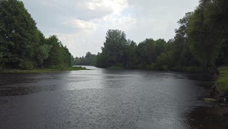 raindrops on water surface. drops fall on surface of river during rain