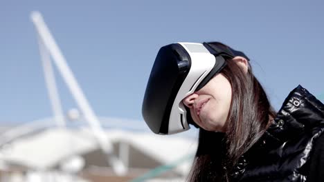 content woman in vr headset on street