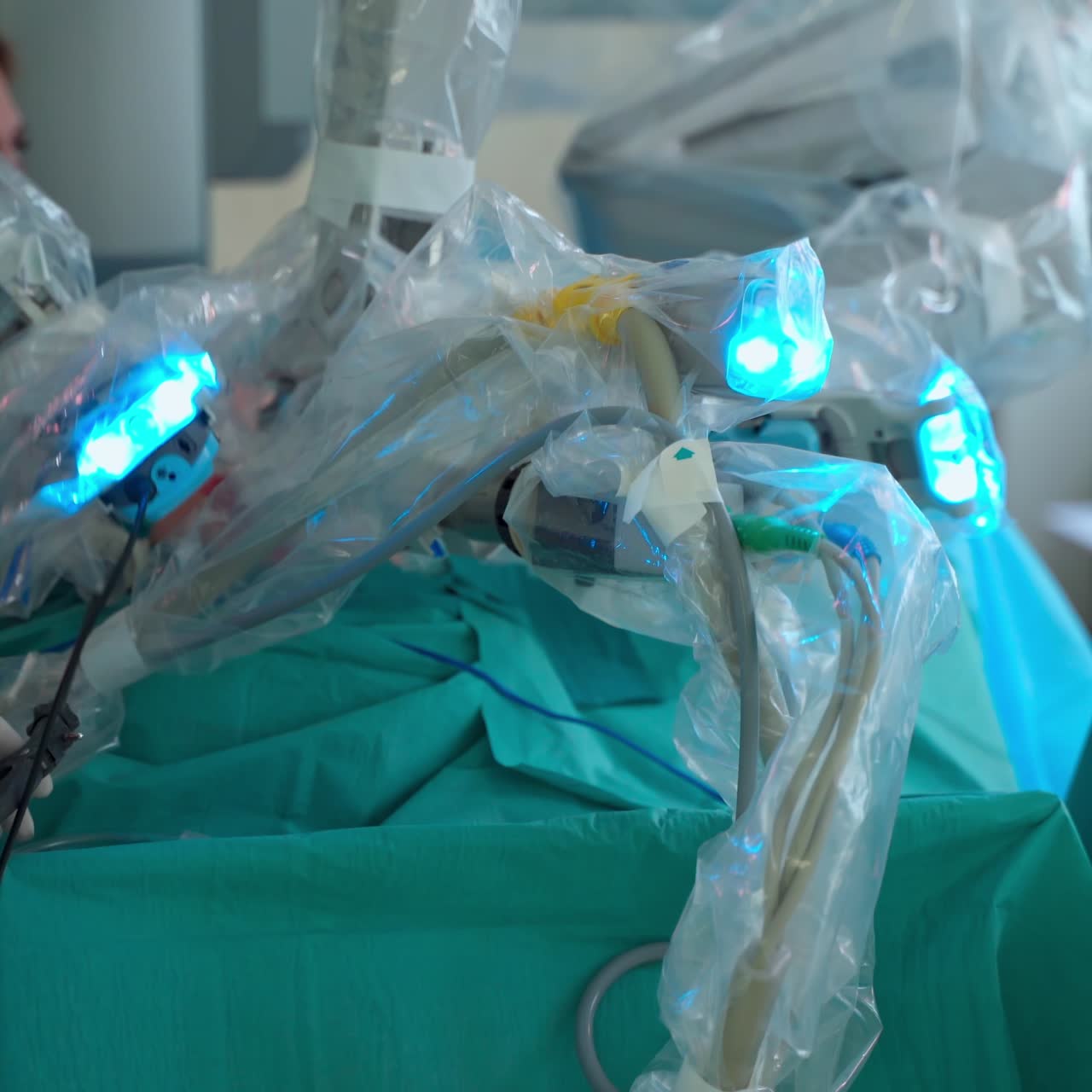 Minimally invasive surgical innovation. Robotic surgery in hospital with modern technology equipment. Machine arms in operating room. Medical procedure with a robot in clinic
