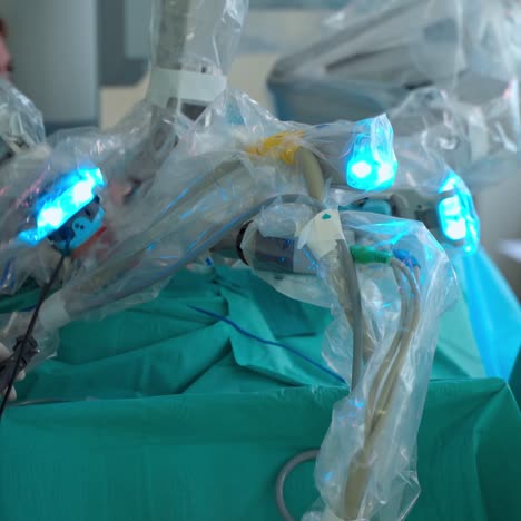 minimally invasive surgical innovation. robotic surgery in hospital with modern technology equipment. machine arms in operating room. medical procedure with a robot in clinic