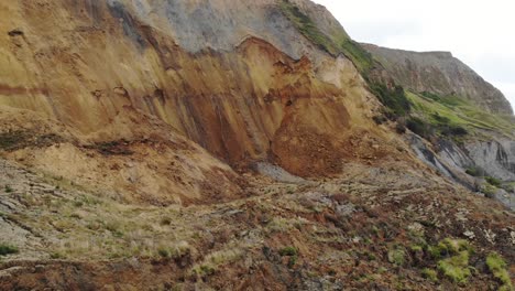 aerial forward shot flying over the 2023 major landslip at seatown dorset england