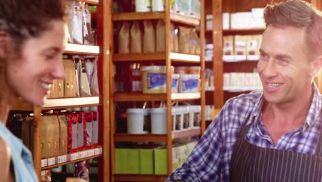 Woman-purchasing-bread-at-bakery-store