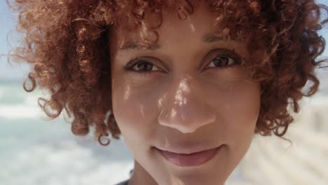 woman looking at camera on the beach 4k