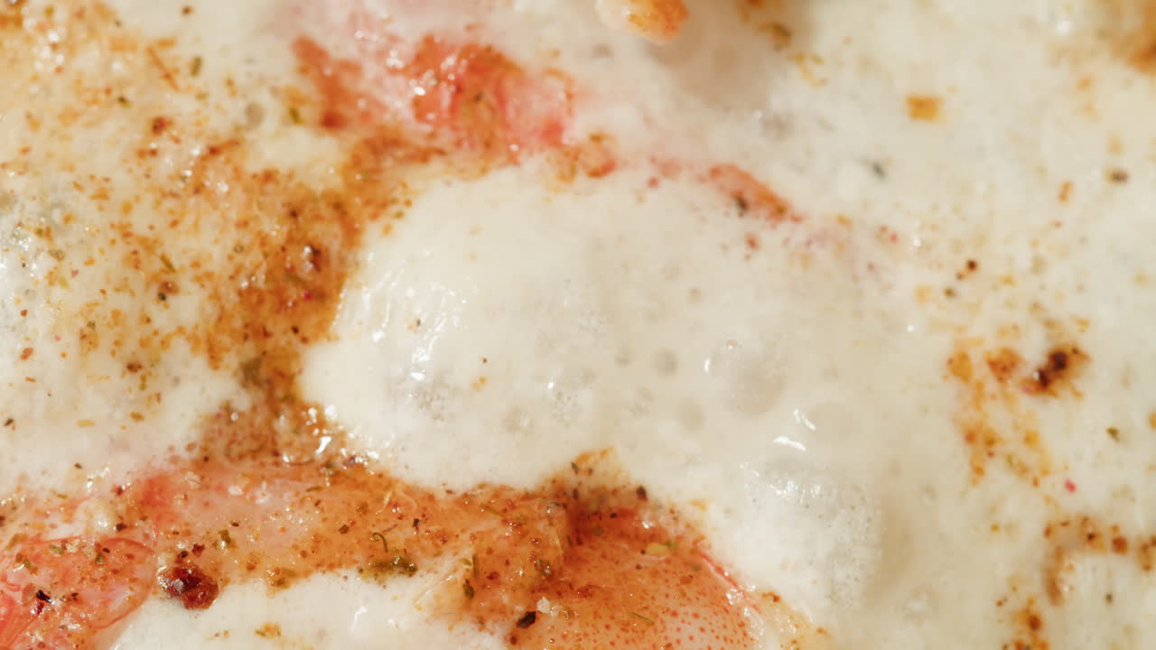 Close-up of a Pizza with Melted Cheese and Toppings