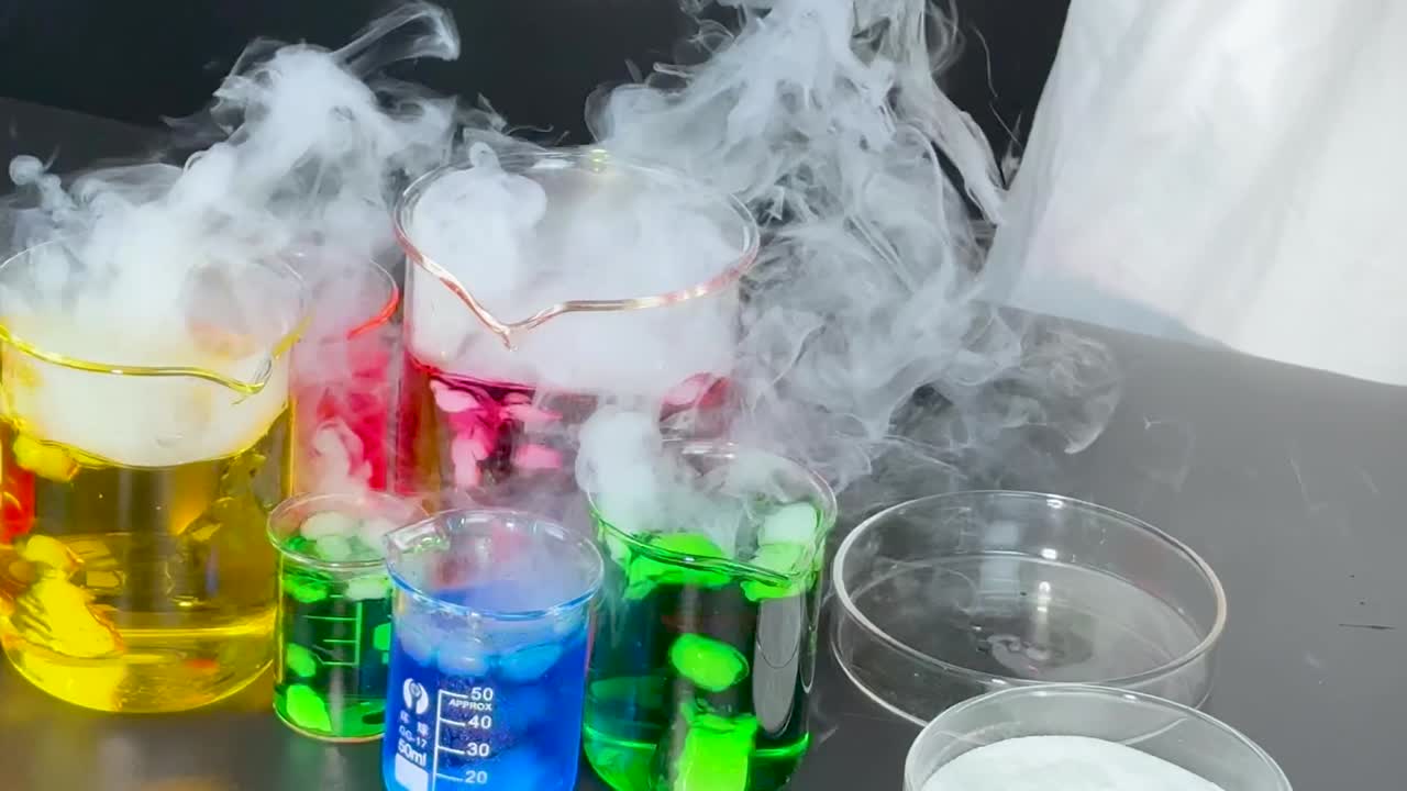 A mesmerizing display of colorful liquids reacting with smoke in laboratory glassware.