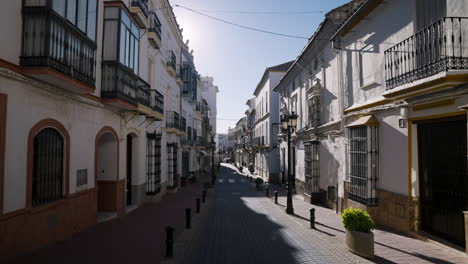 white street in the old town of spanish city olvera, cadiz, andalusia, spain - drone shot