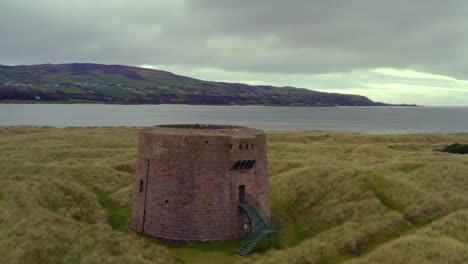 coastal stone tower on sand dunes