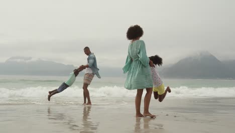 family enjoying free time by the sea