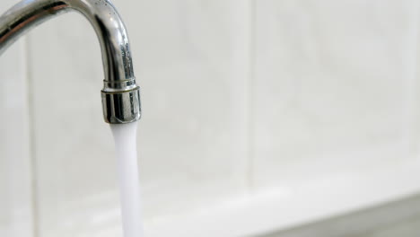 Tap-of-running-water-in-kitchen-sink