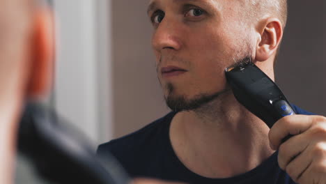 closeup portrait of young man shaves