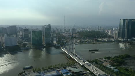 Saigon-river-waterfront-with-long-afternoon-shadows-from-the-Ho-Chi-Minh-City-skyline,-a-symbol-of-modern-Vietnam