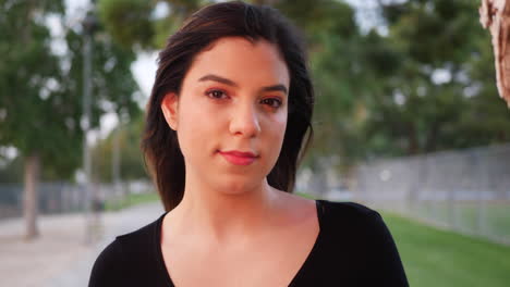 An-attractive-young-hispanic-woman-looking-confident-at-the-camera-with-a-feeling-of-happiness-and-positivity