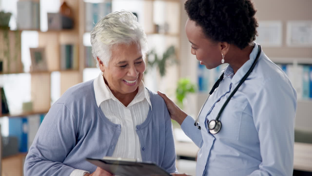 A doctor consulting with an elderly female patient