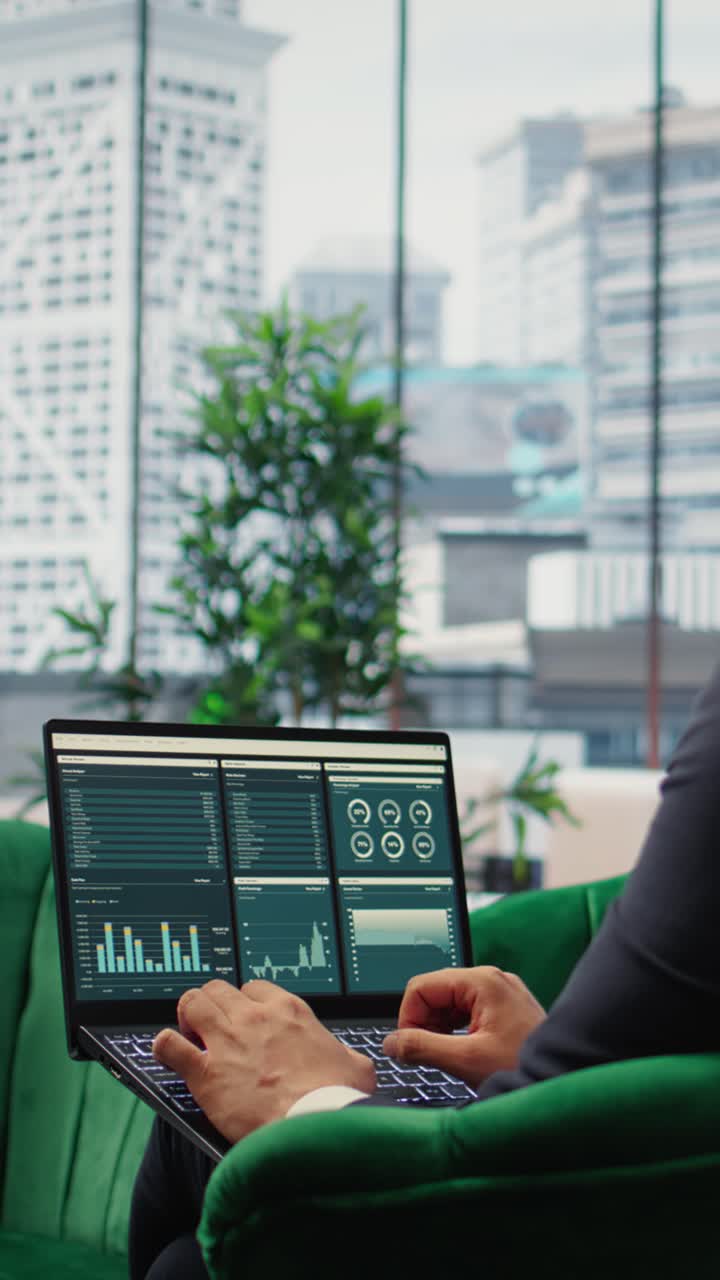 Vertical Video Visionary entrepreneur sits in a high end corporate workspace