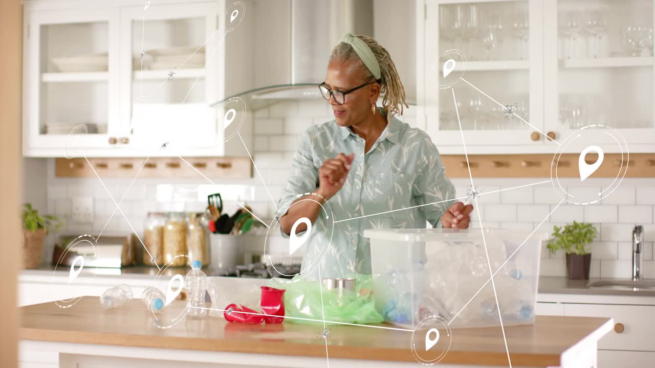 Senior woman scanning kitchen, sorting bottles into clear tub for recycling, UI nodes marking items
