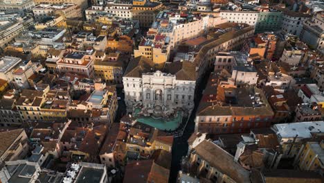 forward drone shot over trevi fountain, downtown rome, italy