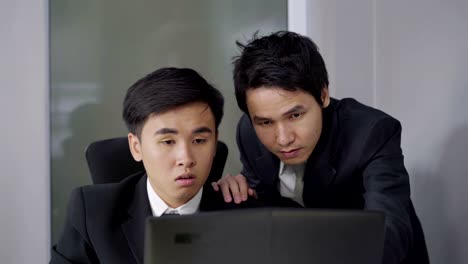 happy two business man using laptop computer to  successful working project