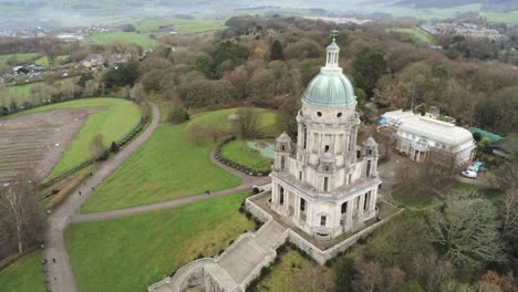 Aerial-view-landmark-historical-copper-dome-building-Ashton-Memorial-English-countryside-high-orbit-left