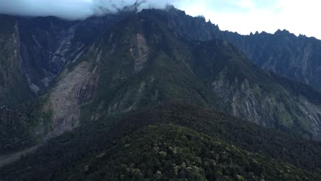 cinematic dramatic close drone shot of mount kinabalu at maragang hill sabah malaysia daylight