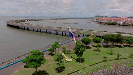 Aerial-shot-of-Panama-flag-and-revealing-casco-antiguo-and-Amador-causeway