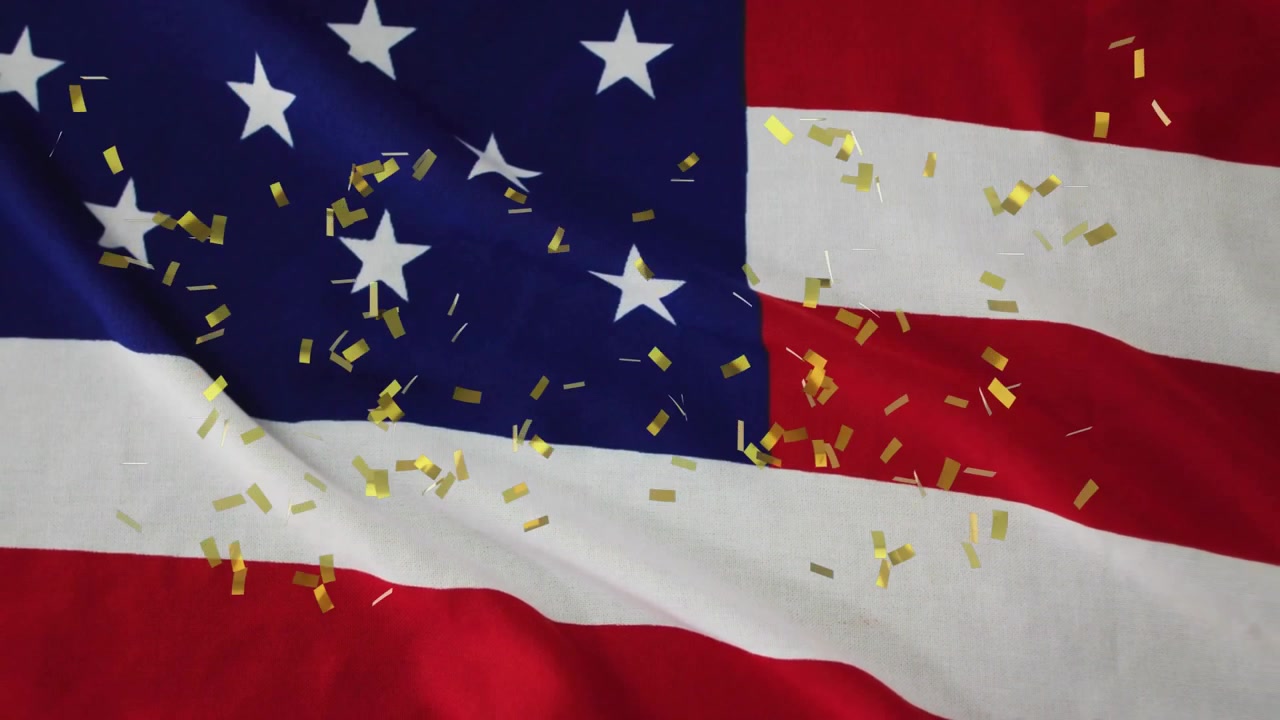 Amerikanska flaggan vajar medan guldkonfetti framträder och sedan driver efter att ljuset skiftar, vilket firar enighet.