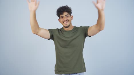 happy man waving at camera.