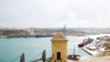 industrial vessels of cargo harbor in malta island with cranes, distance view