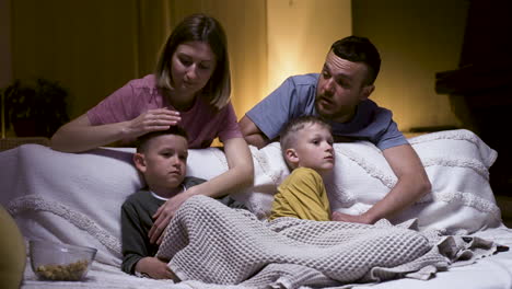 family watching movie in the living room