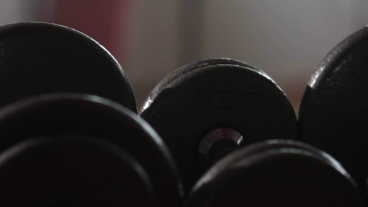 handheld shot of gym weights