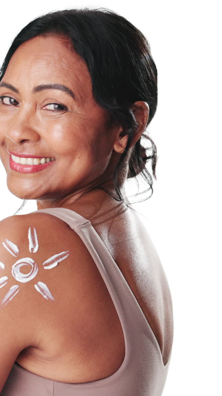 Smiling Woman with Sunscreen Sun Design on Shoulder