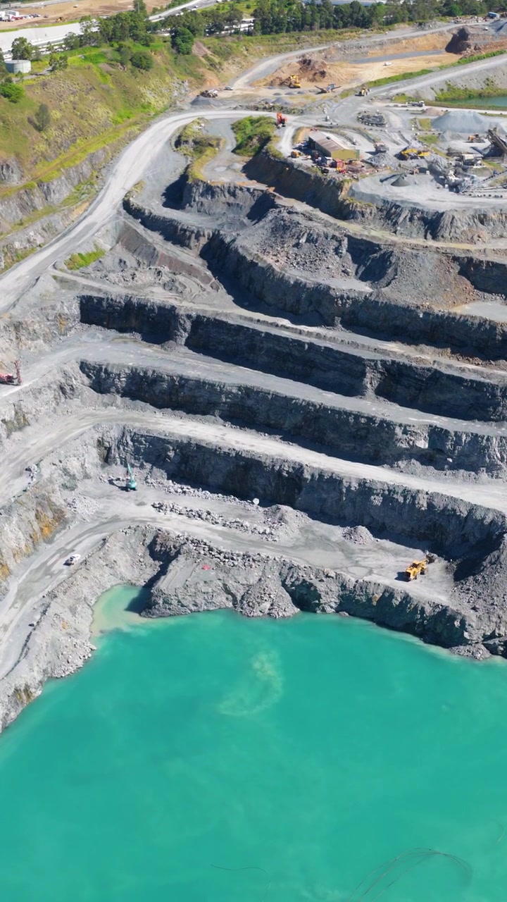 Aerial View of an Open Pit Quarry with Turquoise Water