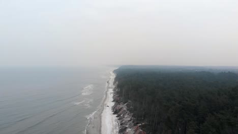 Aerial-shot-of-sandy-beach-in-Ustka-in-winter