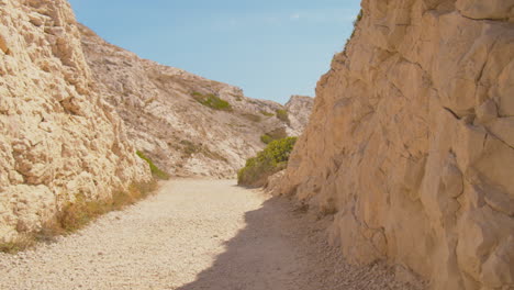 Walking-through-the-picturesque-rock-formation-of-the-Frioul-islands-near-Marseille-in-France