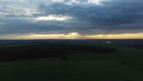 sunset over fields and forest