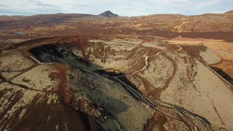 aerial flight of walking paths at volcano crater in iceland