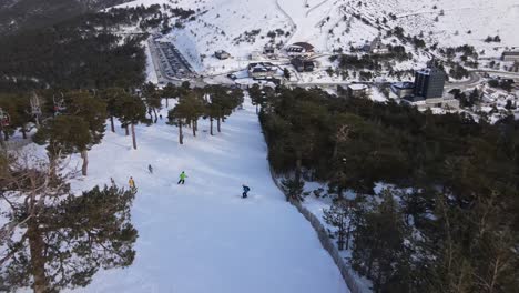 aerial top-down shot following skier from behind going