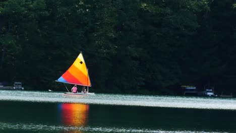 colorful sailboat on lake