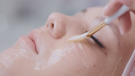 woman receiving facial treatment